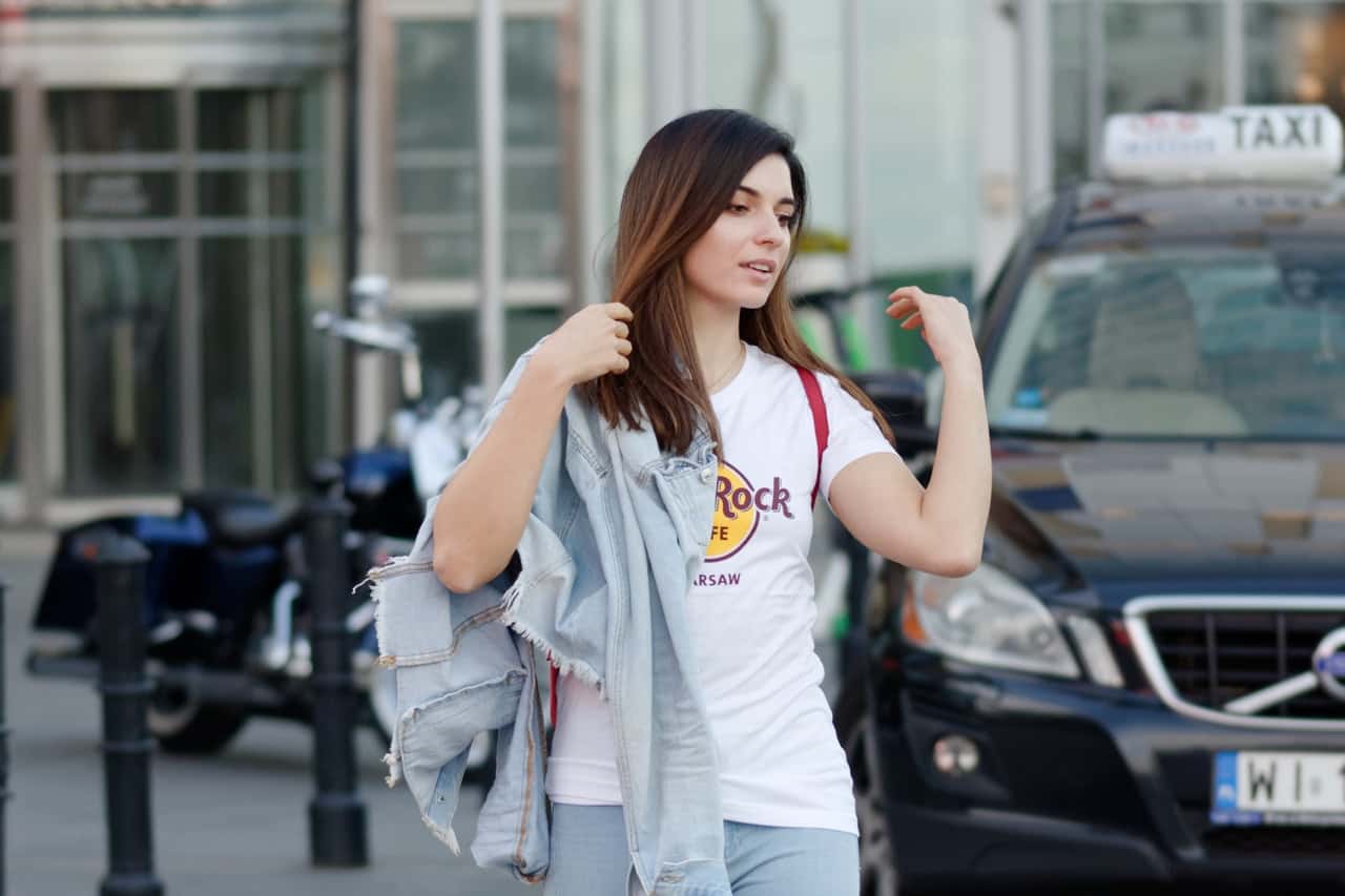 woman-walking-near-black-volvo-suv-2338825