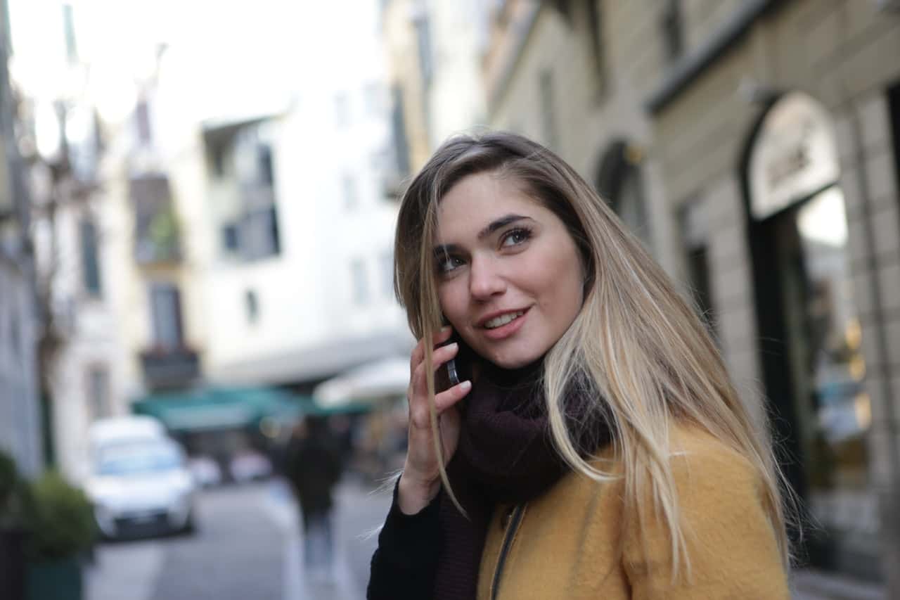 woman-wearing-brown-jacket-and-maroon-scarf-3781727
