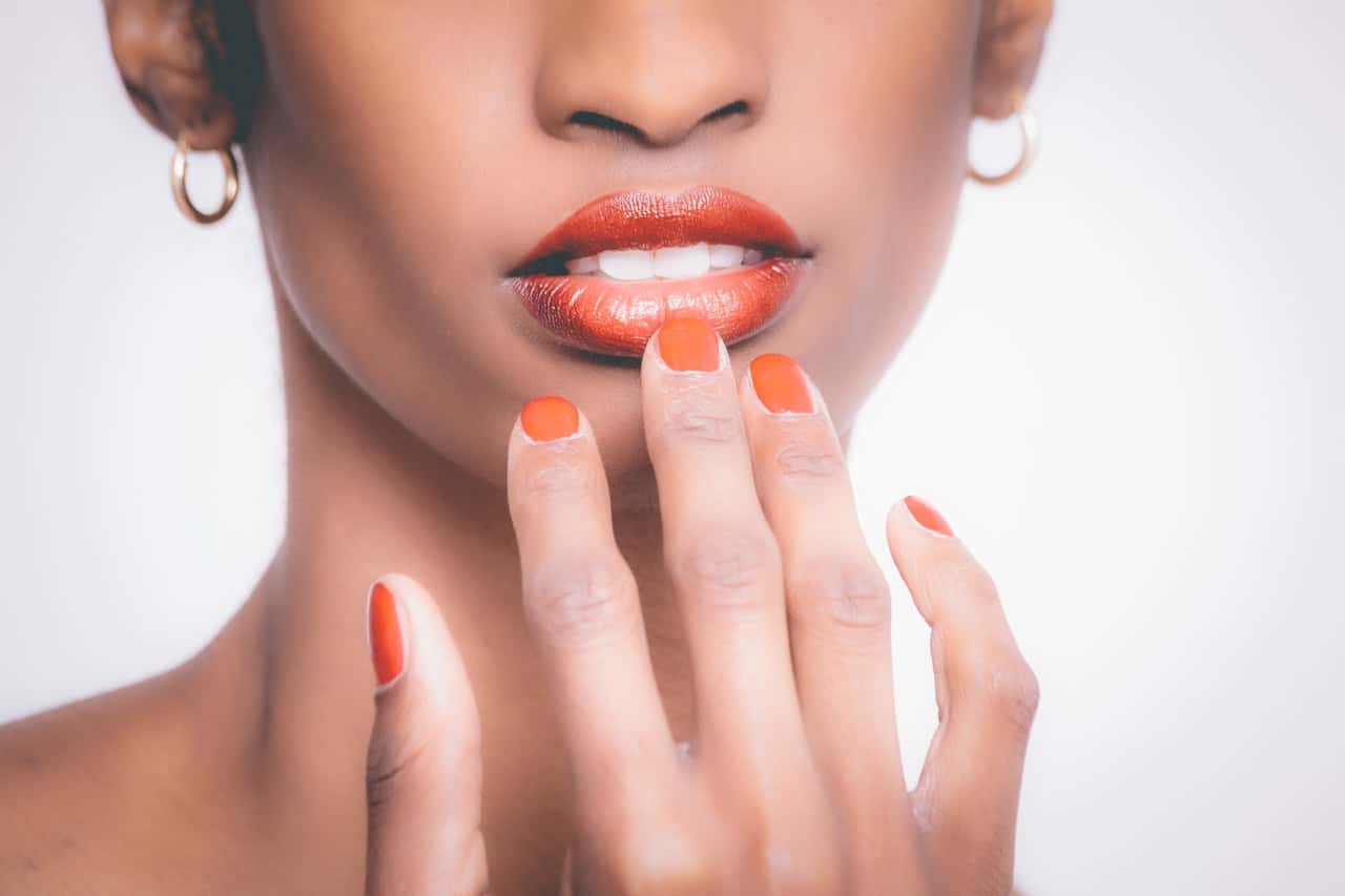 woman-with-orange-manicure-925292