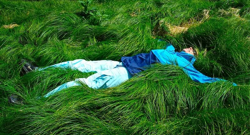 man-lying-down-on-green-grass