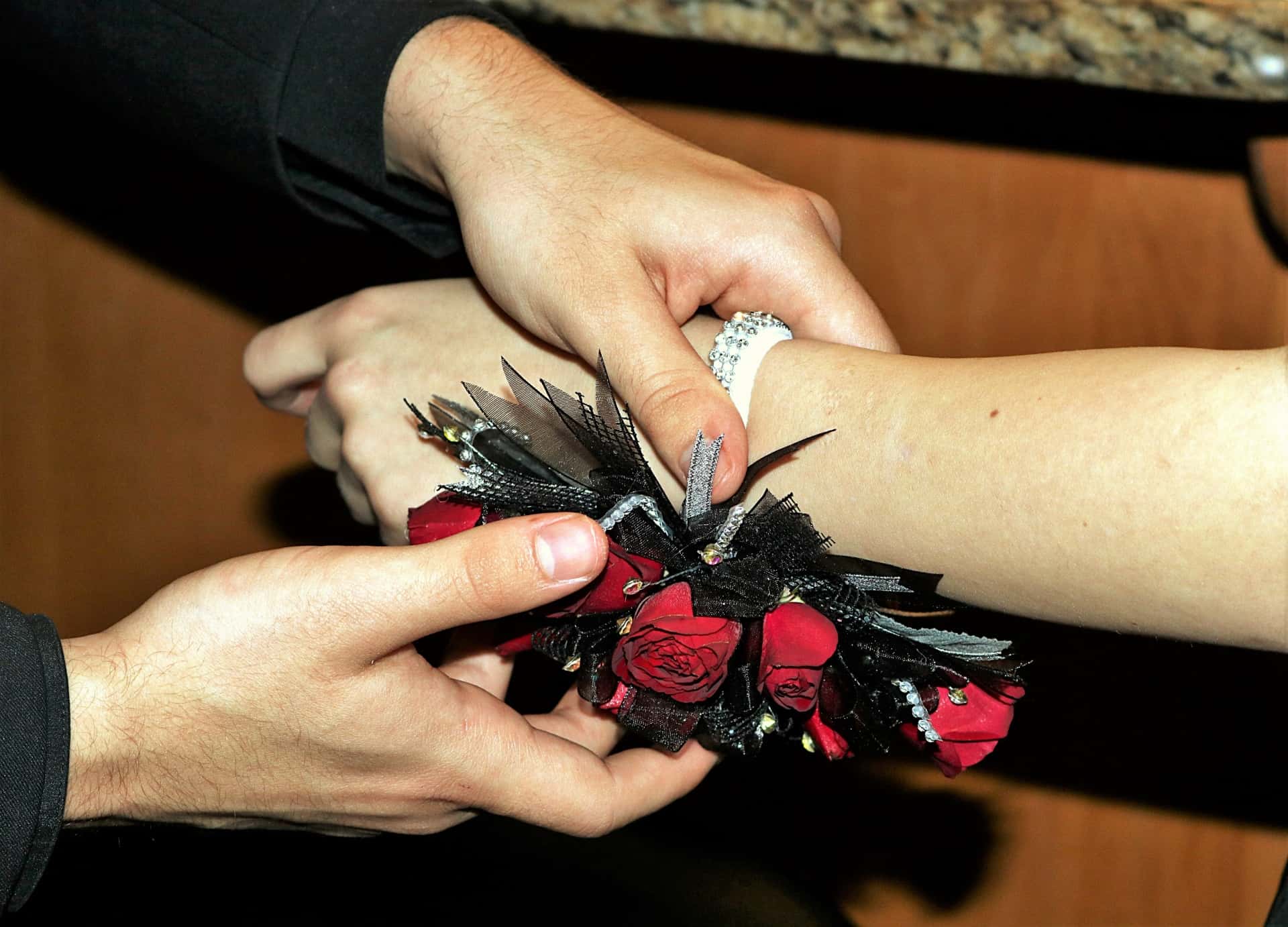 mans-putting-corsage-on-woman