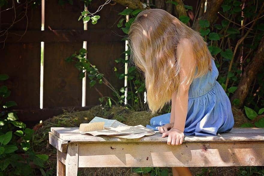person-human-female-girl-blond-long-hair-letters-read-garden